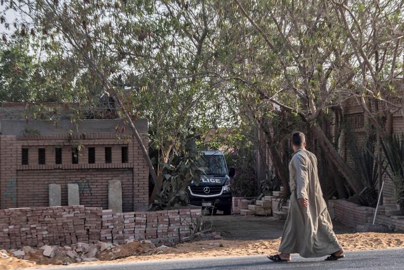 An Egyptian police vehicle is parked inside a cemetery after the former Egyptian President Mohamed Morsi was buried in Cairo. AFP