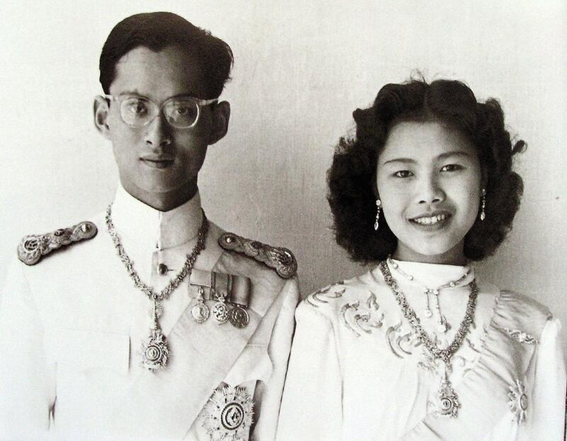 An undated handout photo made available by the Thai Royal Bureau shows portraits of Thai King Bhumibol Adulyadej and Queen Sirikit. Royal Bureau / AFP