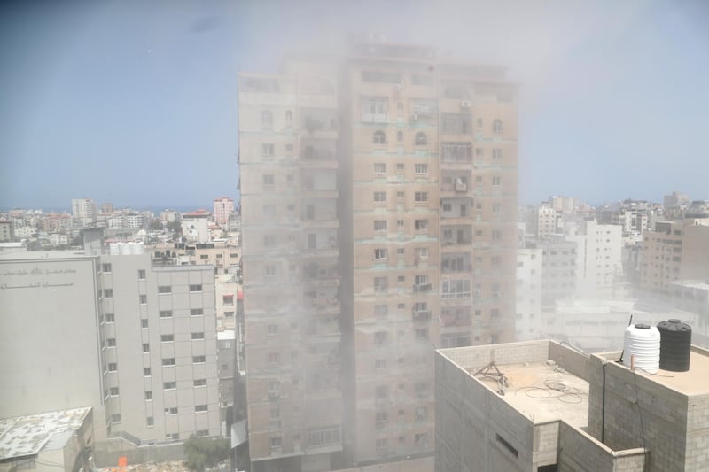 Dust and smoke rise following an Israeli air strike, amid a flare-up of Israeli-Palestinian violence, in Gaza City. Reuters