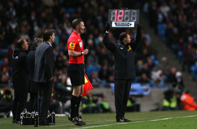 MANCHESTER, ENGLAND - OCTOBER 27:  The board is held up by the Fourth Official showing 12 minutes of injury time to be played during the Barclays Premier League match between Manchester City and Swansea City at the Etihad Stadium on October 27, 2012 in Manchester, England. (Photo by Clive Brunskill/Getty Images) *** Local Caption ***  154837420.jpg