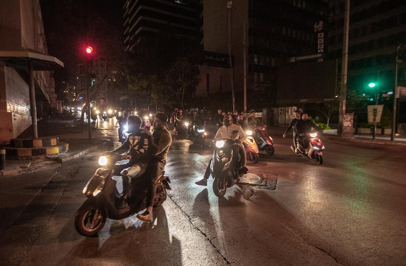 Anti-government protesters ride their motorcycles during a protest against the collapsing Lebanese currency and the price hikes of goods, in front the central bank in Beirut, Lebanon.  EPA