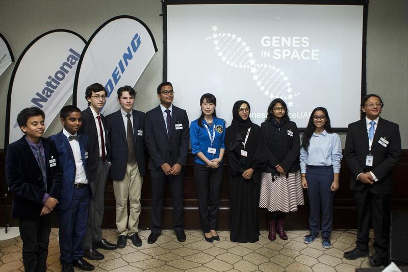 Yamazaki Naoko, a former astronaut, poses with the finalists of the Genes in Space competition. Christopher Pike / The National