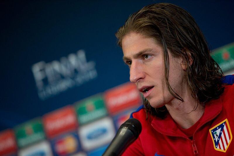 Filipe Luis of Atletico Madrid answers questions during a team press conference after their training session on Monday for the Champions League final. Gonzalo Arroyo Moreno / Getty Images / May 19, 2014