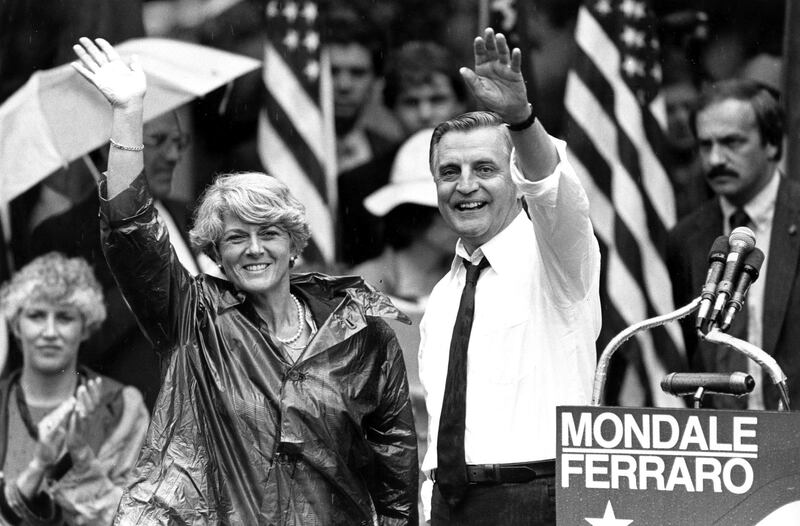 Mondale and running mate Geraldine Ferraro leave a rally in Portland, Oregon in 1984.  AP