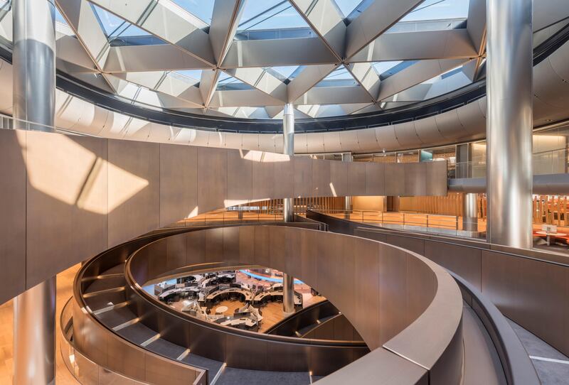 The centrepiece of Bloomberg's interior is a spiralling ramp spanning nearly 700 feet and six floors in a triple-helix formation. Photo credit: Nigel Young/Foster+Partners