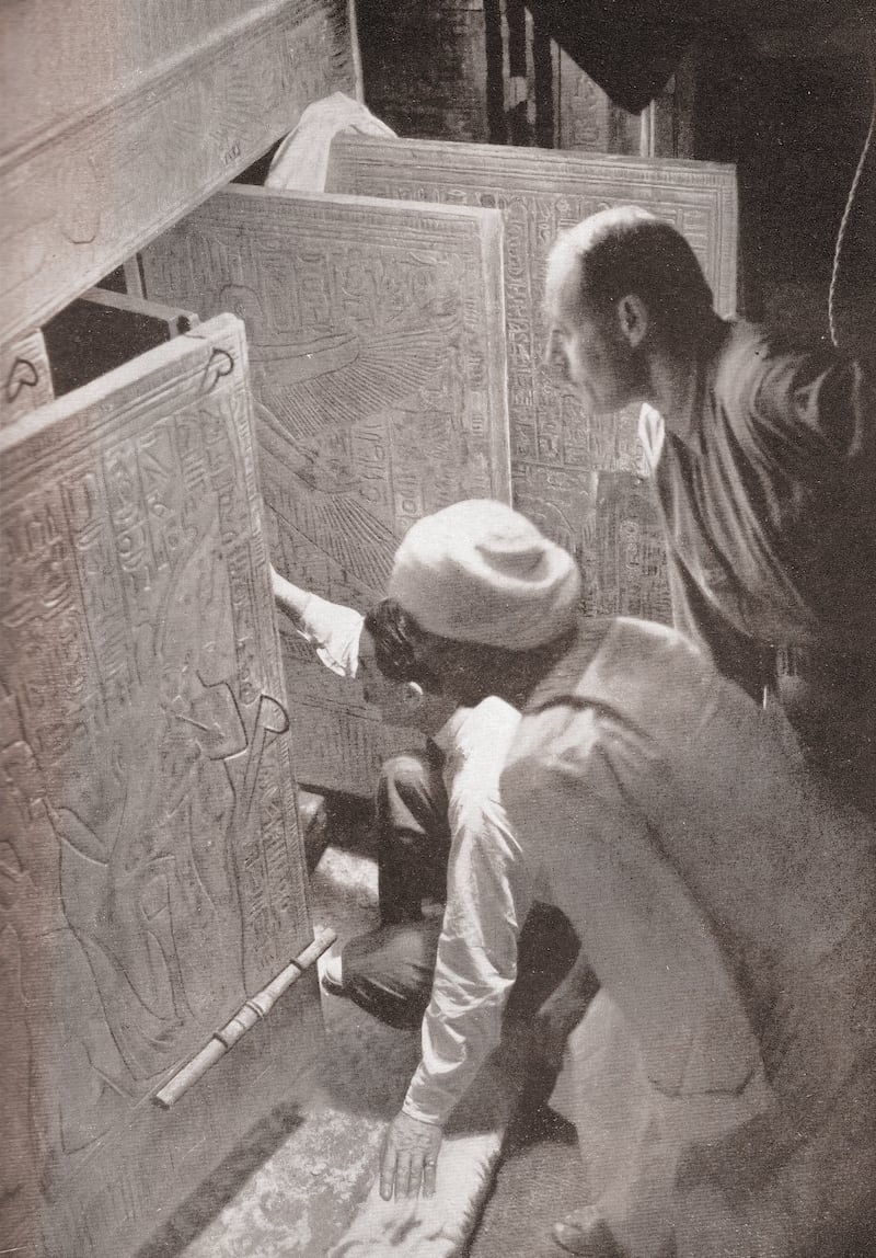 Howard Carter and associates opening the doors of King Tutankhamun's burial shrine in the Valley of the Kings, Egypt; screen print from a photograph, 1923. (Photo by GraphicaArtis/Getty Images)