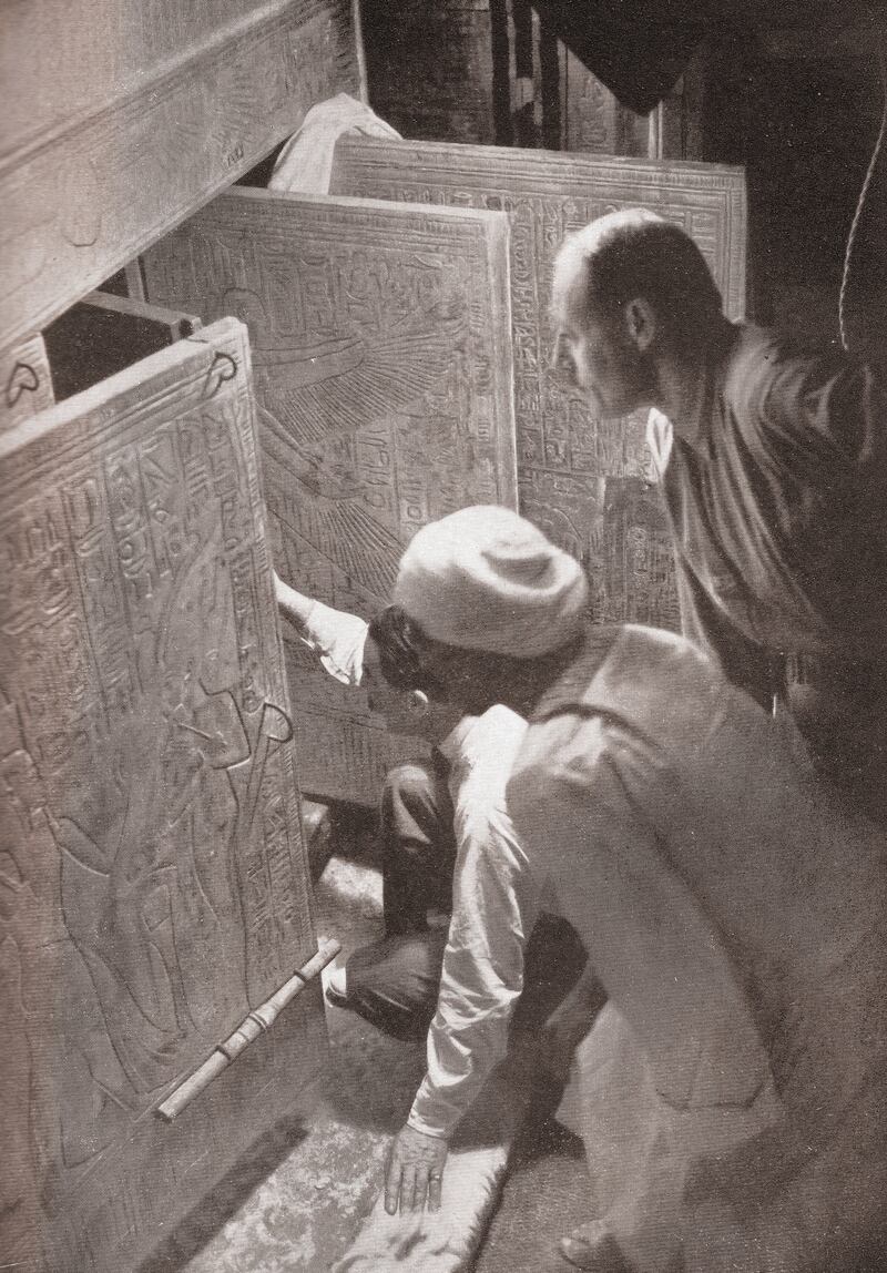 Howard Carter and associates opening the doors of King Tutankhamun's burial shrine in the Valley of the Kings, Egypt; screen print from a photograph, 1923. (Photo by GraphicaArtis/Getty Images)