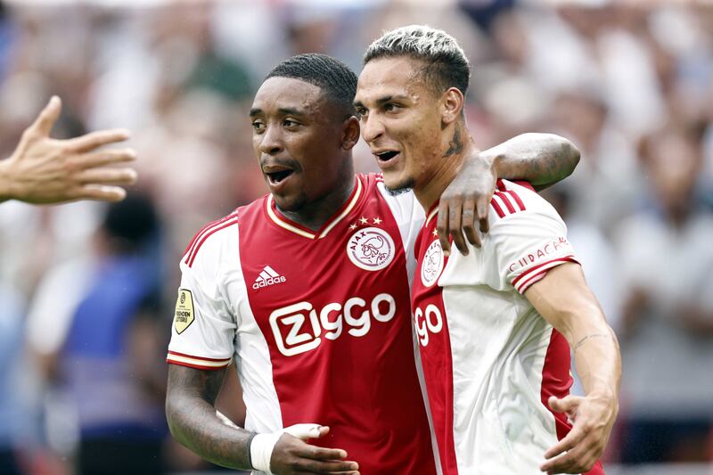 Antony, right, celebrates with Steven Bergwijn against Groningen. EPA