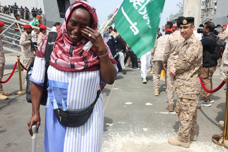 A Sudanese woman disembarking from a Saudi Navy Ship at the Jeddah Sea Port. May 8, 2023.  REUTERS