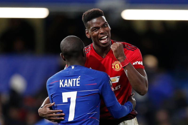 Manchester United's Paul Pogba, right, is hugs Chelsea's N'Golo Kante after the English FA Cup fifth round soccer match between Chelsea and Manchester United at Stamford Bridge stadium in London, Monday, Feb. 18, 2019. (AP Photo/Alastair Grant)