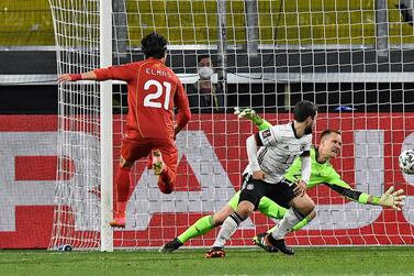 North Macedonia's Eljif Elmas, left, scores the decisive second goal for his side against  during the World Cup 2022 group J qualifying soccer match between Germany and North Macedonia. AP