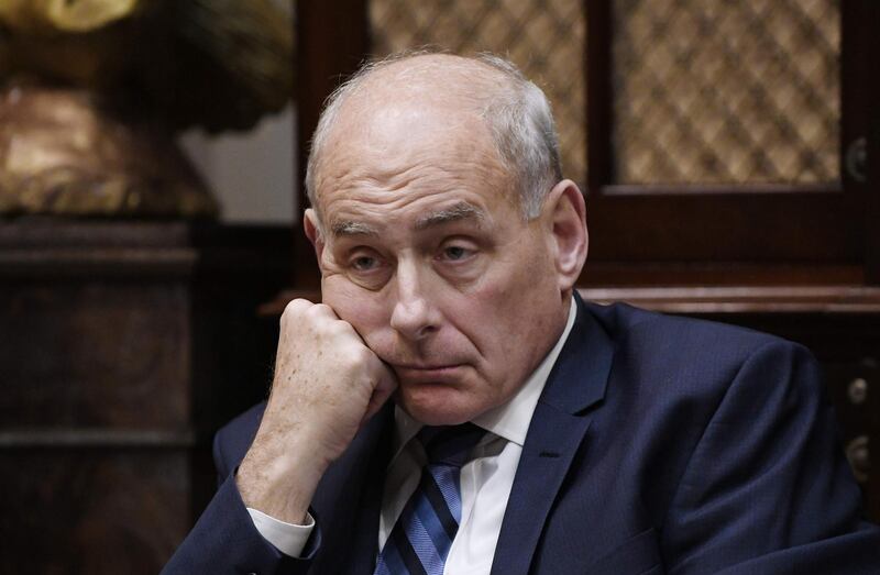 (FILES) In this file photo taken on June 21, 2018,  White House Chief of Staff John Kelly listens to US President Donald Trump during a working lunch with governors in the Roosevelt Room of the White House, in Washington, DC.  Outgoing White House Chief of Staff John Kelly said he had "nothing but compassion" for undocumented migrants crossing into the US and undercut the idea of a border wall in an interview Sunday, December 30, 2018 that jarred with President Donald Trump's tough rhetoric on immigration. / AFP / Olivier Douliery
