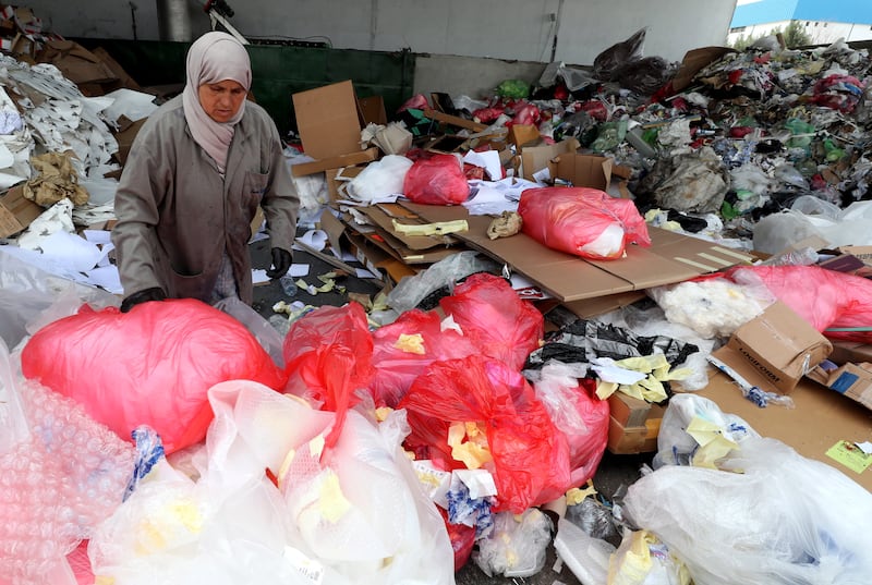 Employees work at a plastic recycling plant in Tunis. EPA
