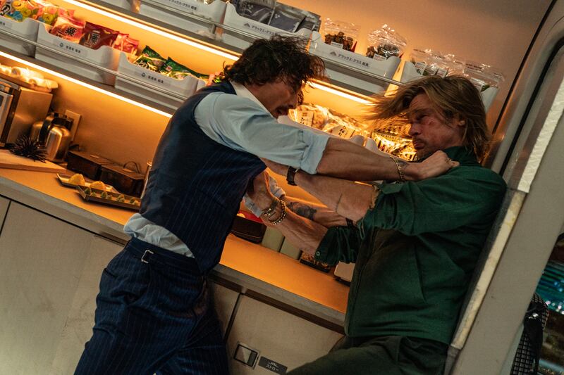 Aaron Taylor-Johnson and Brad Pitt in a scene from 'Bullet Train'. Photo: Sony Pictures