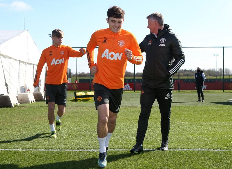 MANCHESTER, ENGLAND - APRIL 02:   Manchester United Head Coach / Manager Ole Gunnar Solskjaer reacts to Brandon Williams and Daniel James of Manchester United during a first team training session at Aon Training Complex on April 2, 2021 in Manchester, England. (Photo by Matthew Peters/Manchester United via Getty Images)