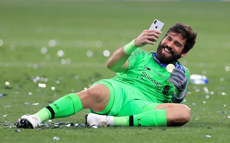 Alisson Becker takes a selfie at the final whistle. PA Photo