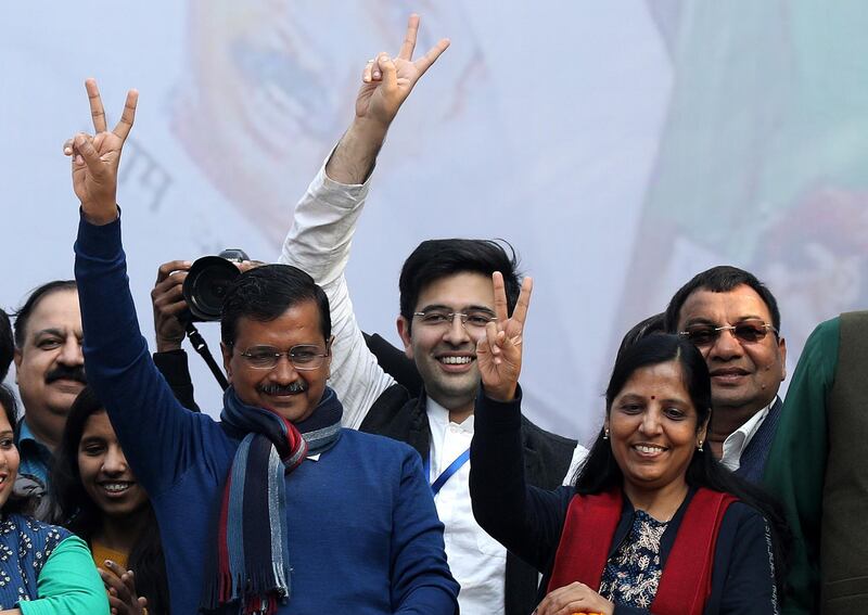 epa08211045 Aam Aadmi Party (AAP) chief and Chief Minister of Delhi Arvind Kejriwal (L) and his wife wife Sunita Kejriwal along with other party senior leaders show victory sign after winning the Delhi Assembly elections, New Delhi, India, 11 February 2020. AAP is set to form the government for the second term in Delhi after the current trends shows it is set for the majority of seats.  EPA/RAJAT GUPTA