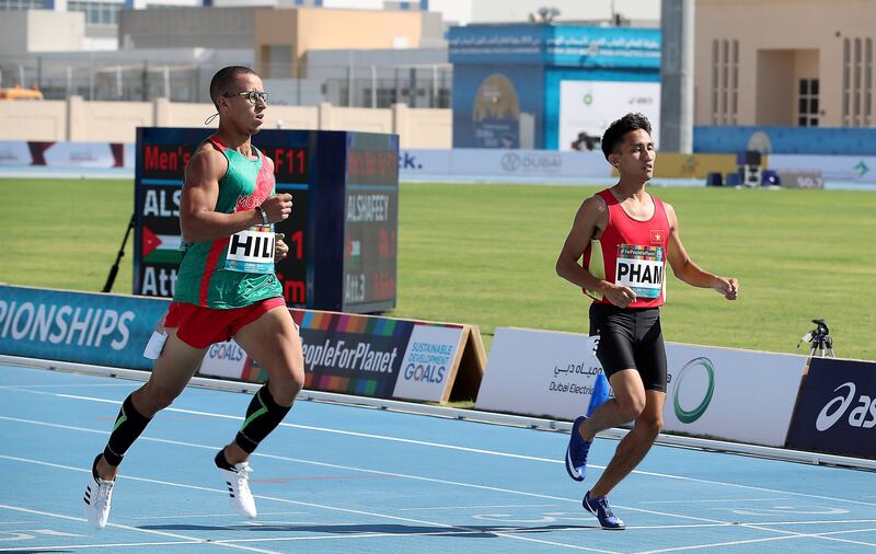 DUBAI, UNITED ARAB EMIRATES , Nov 7  – 2019 :- Abdeslam Hili (MAR left ) won  the men’s 400m T12 round 1 heat 2 during the Dubai 2019 World Para Athletics Championship held at Dubai Club For People Of Determination in Dubai. ( Pawan Singh / The National )  For New. Story by Ramola