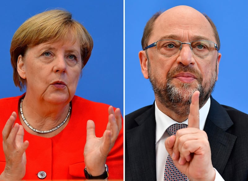 (COMBO) This combination created on September 1, 2017 of file pictures shows German Chancellor Angela Merkel, also leader of the conservative Christian Democratic Union (CDU) party (L, on August 29, 2017 in Berlin) and Martin Schulz, leader of Germany's social democratic SPD party and candidate for Chancellor (June 27, 2017 in Berlin).
Angela Merkel, Germany's cool and collected chancellor, will go head-to-head Sunday, September 3, 2017, with her fiery challenger Martin Schulz in their only television debate before this month's general elections, in a crucial match that could sway millions of voters. / AFP PHOTO / Tobias SCHWARZ