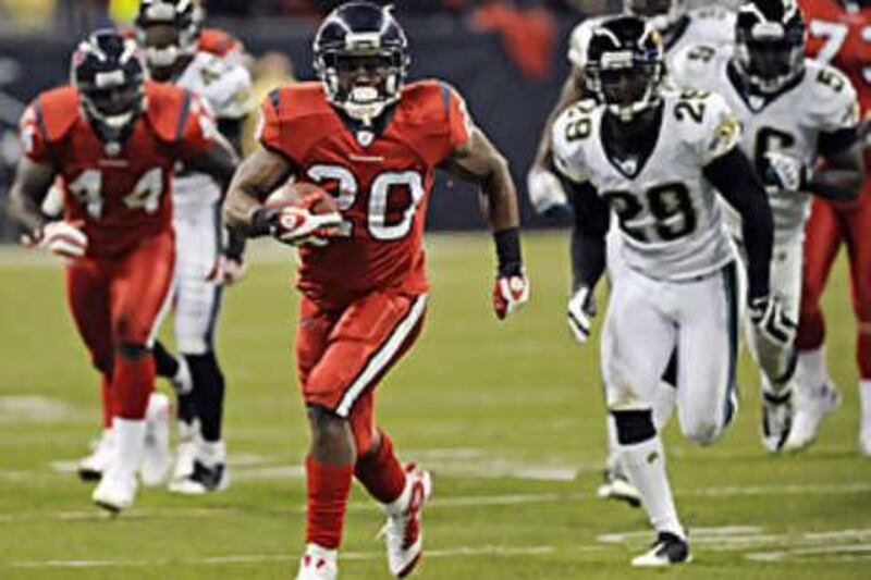 The Houston Texans running back Steve Slaton leaves all of the Jacksonville defence behind.