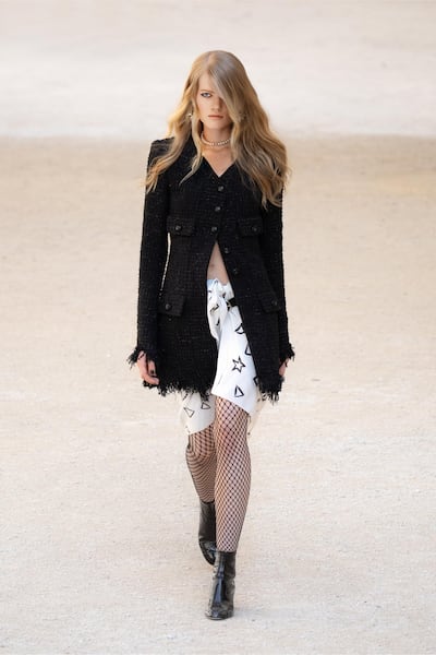 The stars that Jean Cocteau signed next to his name appeared on draped mini skirts for Chanel cruise 2021/22. Courtesy Chanel