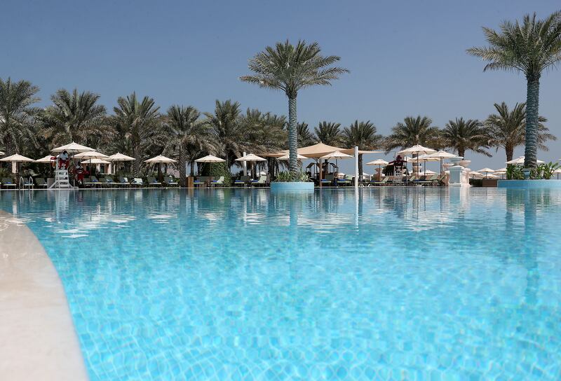 The main swimming pool at Raffles The Palm Dubai