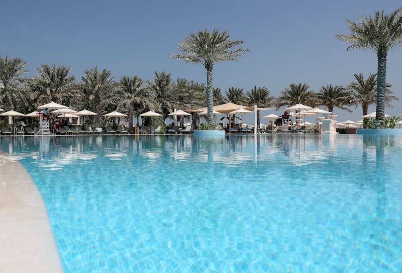 The main swimming pool at Raffles The Palm Dubai