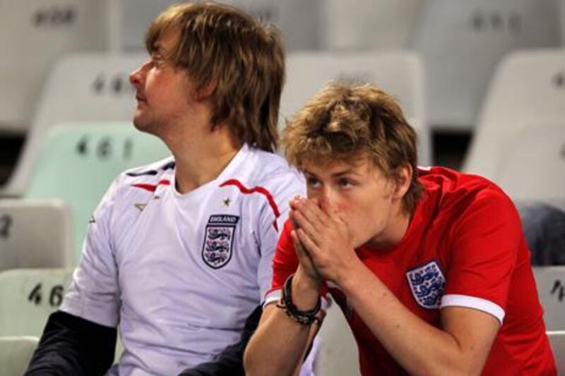 BLOEMFONTEIN, SOUTH AFRICA - JUNE 27:  Dejected England fans after being knocked out of the tournament during the 2010 FIFA World Cup South Africa Round of Sixteen match between Germany and England at Free State Stadium on June 27, 2010 in Bloemfontein, South Africa.  (Photo by Clive Rose/Getty Images)