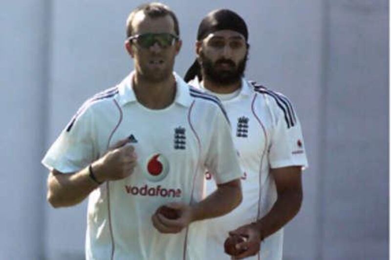 England's Monty Panesar, right with Graeme Swann, did not have a good first Test but the coach Peter Moores is backing him.
