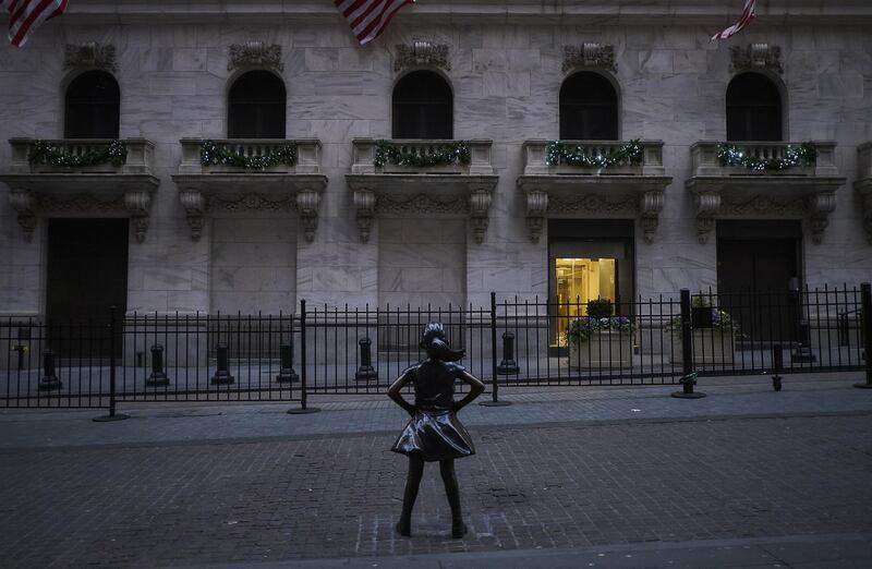 The "Fearless Girl" statue stands outside the New York Stock Exchange (NYSE) in New York, U.S., on Thursday, Dec. 27, 2018. Volatility returned to U.S. markets, with stocks tumbling back toward a bear market after the biggest rally in nearly a decade evaporates. Photographer: John Taggart/Bloomberg