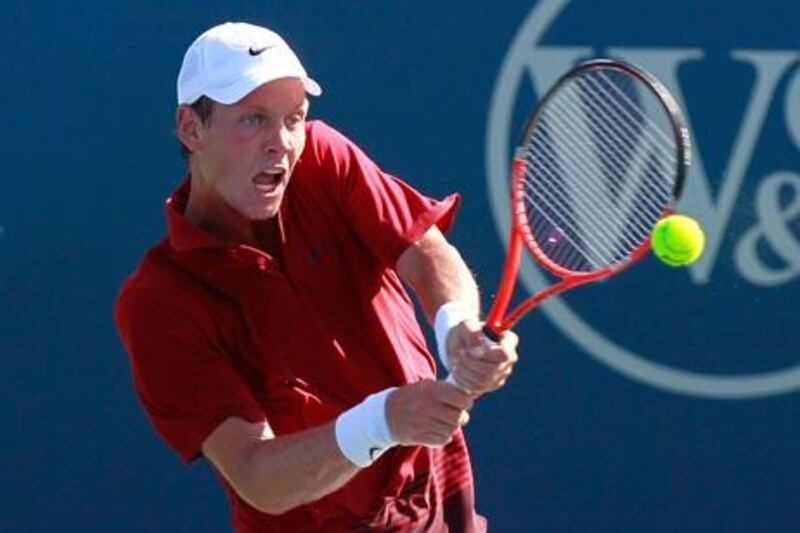 CINCINNATI - AUGUST 19: Tomas Berdych of the Czech Republic returns a backhand to Marcos Baghdatis of Cyprus during Day 4 of the Western & Southern Financial Group Masters at the Lindner Family Tennis Center on August 19, 2010 in Cincinnati, Ohio.   Kevin C. Cox/Getty Images/AFP