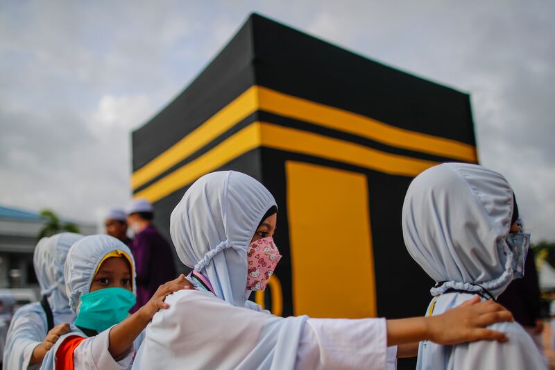 Children performing 'Tawaf'. 