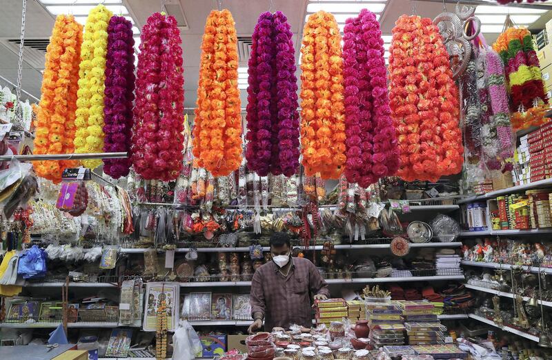 DUBAI, UNITED ARAB EMIRATES , November 1 – 2020 :- Vijay Kumar arranging decoration items for Diwali festival at his shop in Bur Dubai area in Dubai. Diwali is the Indian festival of lights and this year it will be on 14th November. (Pawan Singh / The National) For News/Standalone/Online/Instagram/Big Picture 