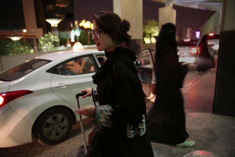 A woman waits for an Uber at a Riyadh mall. Saudi Arabia has invested billions of dollars in Uber. Carolyn Cole / LA Times / Getty Images