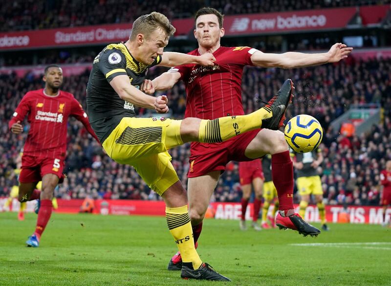Liverpool's Andrew Robertson, right, challenges Southampton's James Ward-Prowse on Saturday. AP