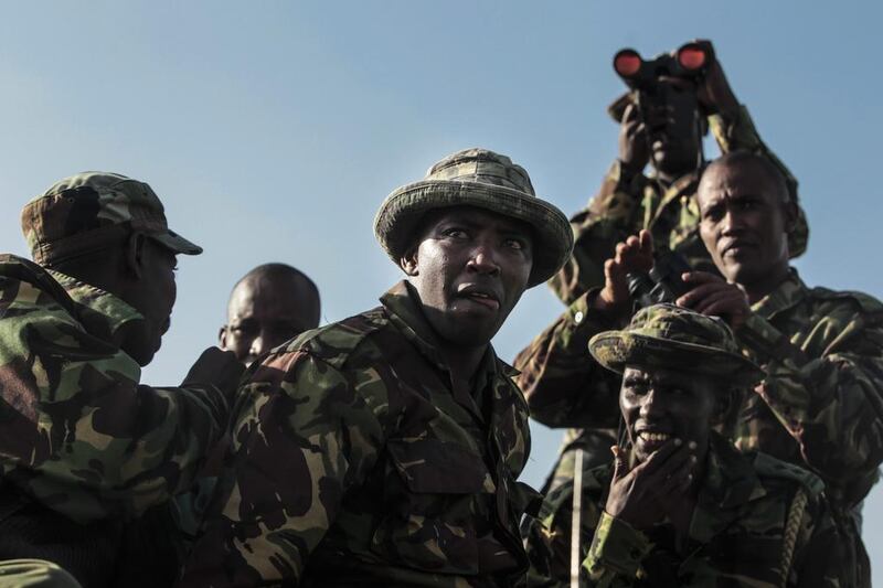 Rangers of the Narok County Government's rhino protection team aboard a truck try to spot black rhinos in the Masai Mara National Reserve,  Kenya. The number of rhinos has almost doubled to 59 last year from 30 in 2012, says the Kenya Wildlife Service.  Dai Kurokawa / EPA