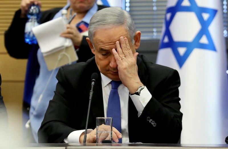 TOPSHOT - Israeli Prime Minister Benjamin Netanyahu gestures as he speaks during a meeting of the right-wing bloc at the Knesset (Israeli parliament) in Jerusalem on November 20, 2019. / AFP / GALI TIBBON
