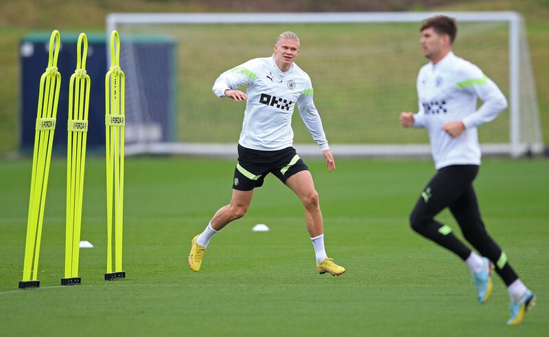 Manchester City striker Erling Haaland and defender John Stones. AFP