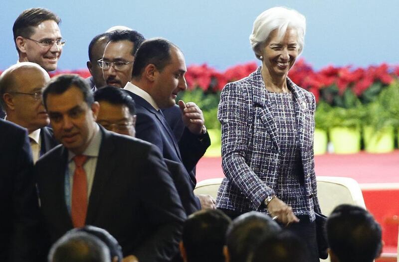 IMF managing director Christine Lagarde, right, arrives at the Belt and Road Forum in Beijing. Thomas Peter / AP Photo