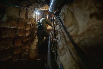 An Israeli soldier in a tunnel that crossed from Lebanon to northern Israel, near Zarit, that was discovered in 2019. AP
