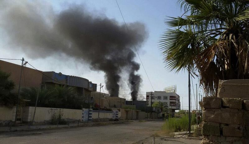 Smoke rises in Fallujah on Tuesday after bombing targeting ISIL positions. AP Photo