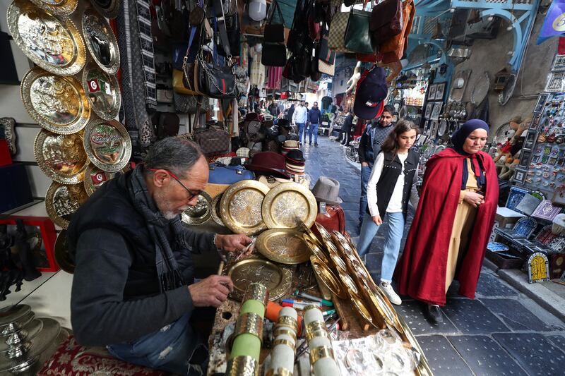 A craftsman at work in the souq of the old city in Tunis, Tunisia. EPA 