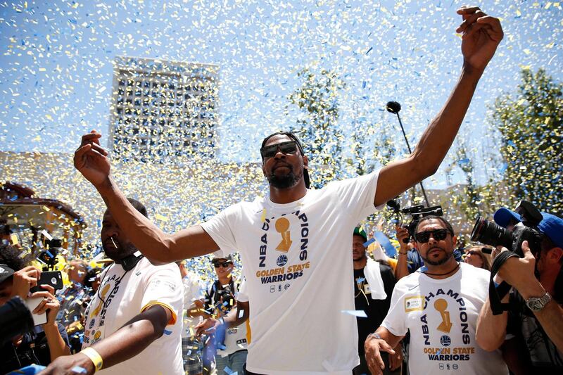 Golden State Warriors forward Kevin Durant celebrates with fans. Durant was named NBA Finals MVP for the second season running. Cary Edmondson / Reuters