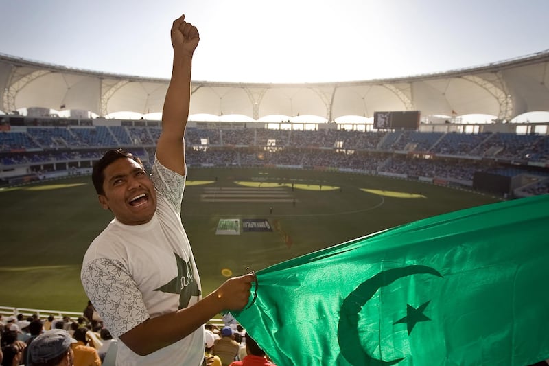 United Arab Emirates -Dubai- April 22, 2009:

SPORTS: Malik Habibullah (cq-al) cheers on Pakistan as they take on Australia during the Chapal Cup at the Dubai Sports City stadium in Dubai on Wednesday, April 22, 2009. Amy Leang/The National
 *** Local Caption ***  amy_042209_cricket_10.jpg