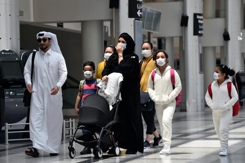 epa08520293 People wearing protective face masks against Covid-19 are pictured at the departure terminal of the Rafic Hariri international airport during its re-opening in Beirut, Lebanon, 01 July 2020. Rafic Hariri international airport has been closed for several months due to the ongoing pandemic of the Covid-19 disease. The airport will operate at 10 percent capacity, which is expected to bring in around 2,000 travelers per day.  EPA/WAEL HAMZEH