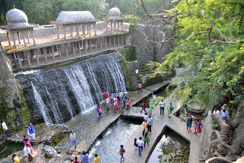 This photo, taken on October 31, 2014, shows Indian visitors in the Rock Garden in Chandigarh, built by self-taught Indian artist and sculptor Nek Chand over the course of 18 years. NARINDER NANU/AFP PHOTO



