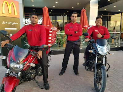 Sanal Pchikaran, Mohammed Zubari and Jhomar Dizon, delivery riders at the McDonald’s branch in Jumeirah, Dubai.  