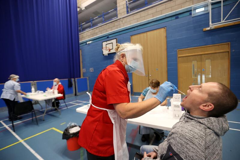 A health worker takes a swab for Covid-19 test at a Stoke-on-Trent City Council facility. Reuters