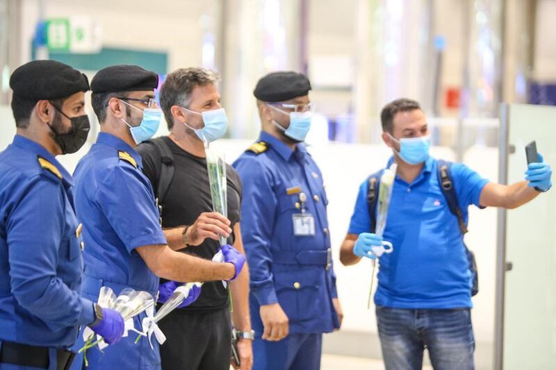 Passengers from Beirut were presented with flowers upon arrival at Dubai International Airport last night. Courtesy: Dubai Customs