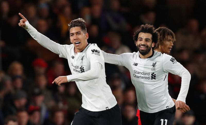 Soccer Football - Premier League - AFC Bournemouth vs Liverpool - Vitality Stadium, Bournemouth, Britain - December 17, 2017   Liverpool's Roberto Firmino celebrates scoring their fourth goal with Mohamed Salah    Action Images via Reuters/Paul Childs    EDITORIAL USE ONLY. No use with unauthorized audio, video, data, fixture lists, club/league logos or "live" services. Online in-match use limited to 75 images, no video emulation. No use in betting, games or single club/league/player publications.  Please contact your account representative for further details.